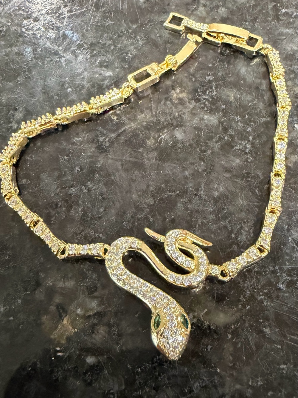Gold Snake Bracelet with Green Stone Eyes